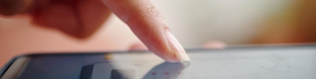 A close-up of a hand pointing at a line item on a financial statement, emphasizing the detail involved in tracking down unclaimed benefits. The statement shows different types of retirement accounts.