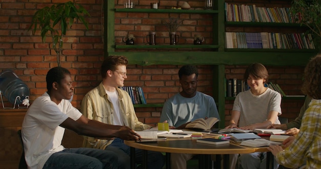 A diverse group of students studying together on a college campus, with a focus on their collaborative and supportive environment.